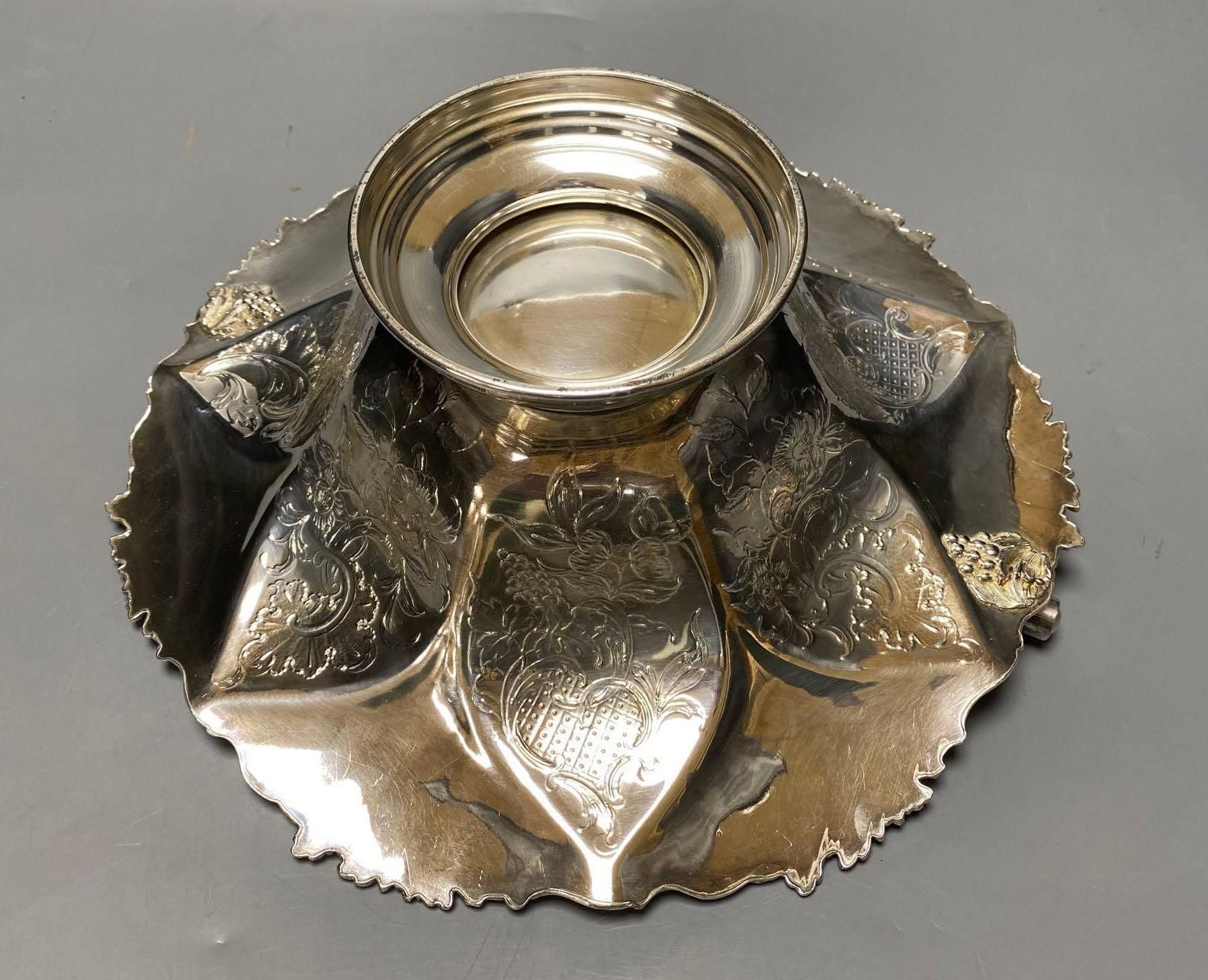 A silver plated cake basket, with cast border, diameter 31cm, two plated trays and three other items